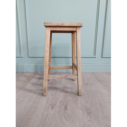 667 - Two early 20th C. pine stools {61 cm H x 33 cm W x 30 cm D and 61 cm H x 33 cm W x 31 cm D}.