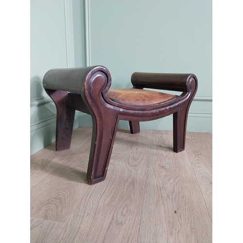 668 - Mahogany foot stool with leather upholstered seat in the lyre form {41 cm H x 40 cm W x 64 cm D}.