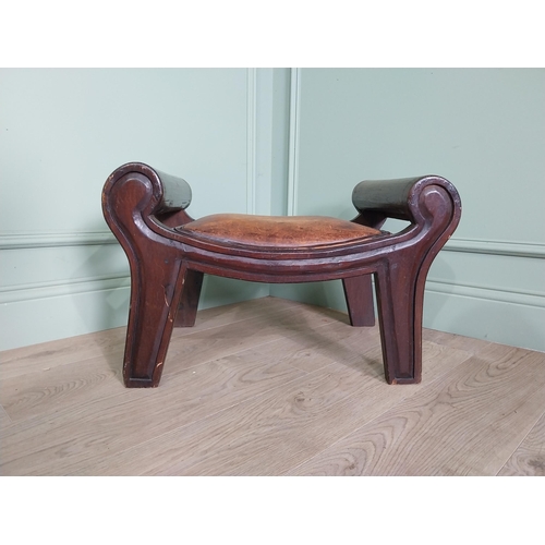 668 - Mahogany foot stool with leather upholstered seat in the lyre form {41 cm H x 40 cm W x 64 cm D}.