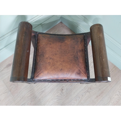 668 - Mahogany foot stool with leather upholstered seat in the lyre form {41 cm H x 40 cm W x 64 cm D}.