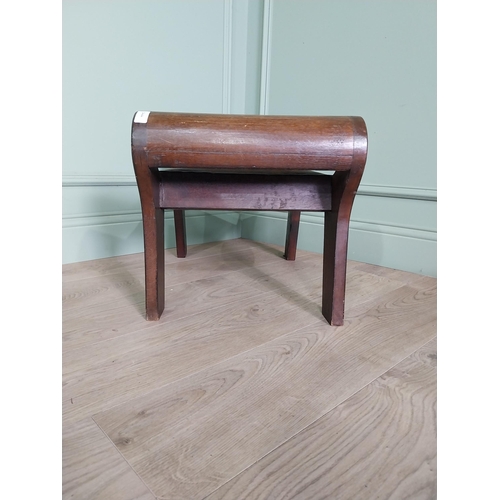 668 - Mahogany foot stool with leather upholstered seat in the lyre form {41 cm H x 40 cm W x 64 cm D}.