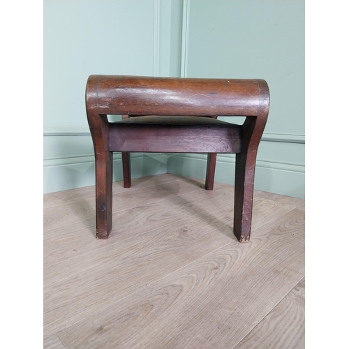 668 - Mahogany foot stool with leather upholstered seat in the lyre form {41 cm H x 40 cm W x 64 cm D}.