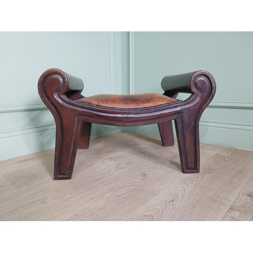 668 - Mahogany foot stool with leather upholstered seat in the lyre form {41 cm H x 40 cm W x 64 cm D}.