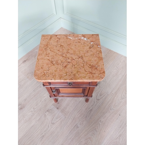 673 - Edwardian mahogany bedside locker with marble top and single drawer over blind door raised on turned... 