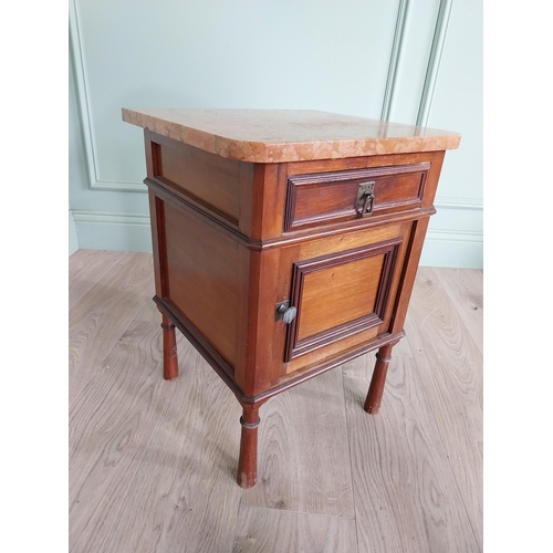 673 - Edwardian mahogany bedside locker with marble top and single drawer over blind door raised on turned... 