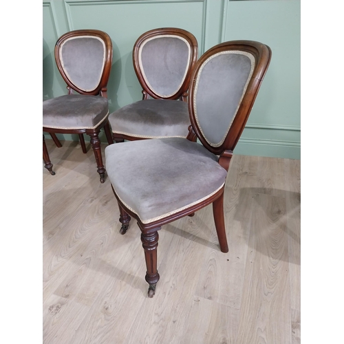 676 - Set of five Victorian mahogany and upholstered dining chairs raised on turned legs and brass castors... 