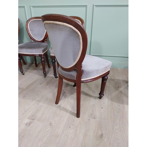 676 - Set of five Victorian mahogany and upholstered dining chairs raised on turned legs and brass castors... 