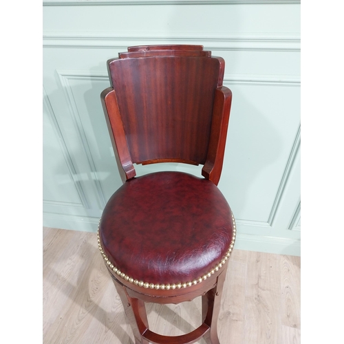 680 - Mahogany revolving high bar stool with leather upholstered seat in the Art Deco style {124 cm H x 47... 