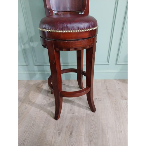 680 - Mahogany revolving high bar stool with leather upholstered seat in the Art Deco style {124 cm H x 47... 