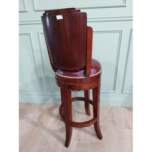 680 - Mahogany revolving high bar stool with leather upholstered seat in the Art Deco style {124 cm H x 47... 