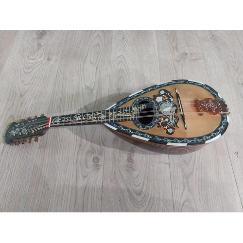 681 - Mandolin with mother of pearl inlaid in leather case.