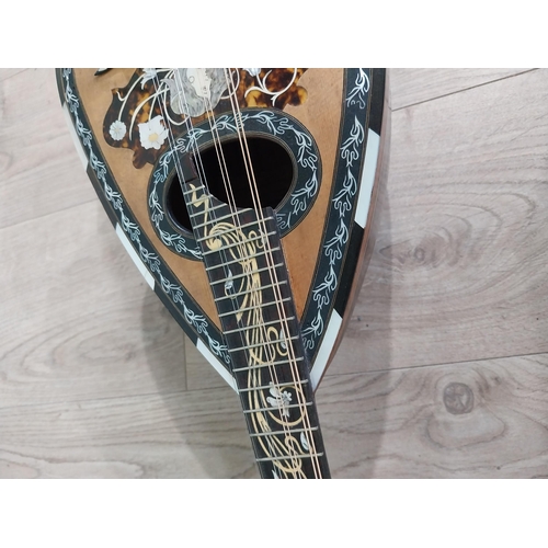 681 - Mandolin with mother of pearl inlaid in leather case.