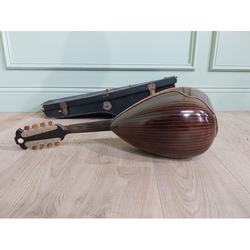 681 - Mandolin with mother of pearl inlaid in leather case.