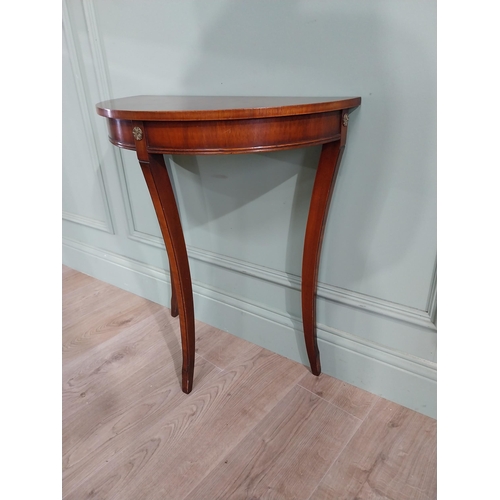 682 - Burr walnut demi-lune side table raised on tapered legs {70 cm H x 61 cm W x 30 cm D}.