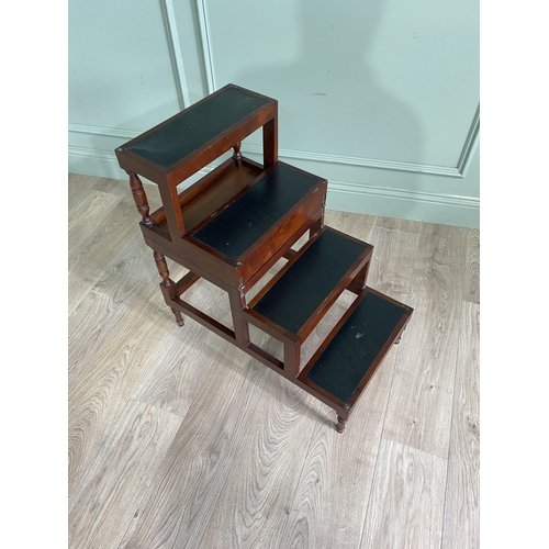 683 - Mahogany metamorphic library steps with inset leather panels raised on turned legs in the Georgian s... 