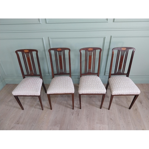 694 - Set of four mahogany and satinwood dining room chairs with upholstered seats raised on square tapere... 