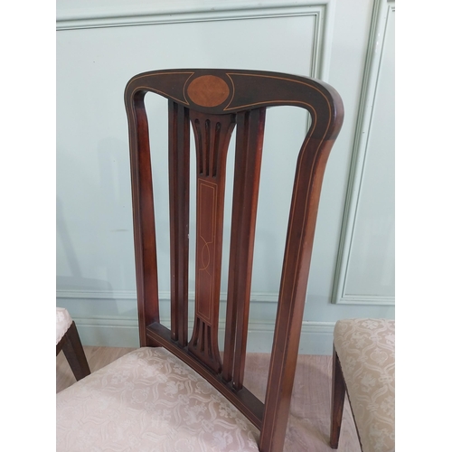 694 - Set of four mahogany and satinwood dining room chairs with upholstered seats raised on square tapere... 