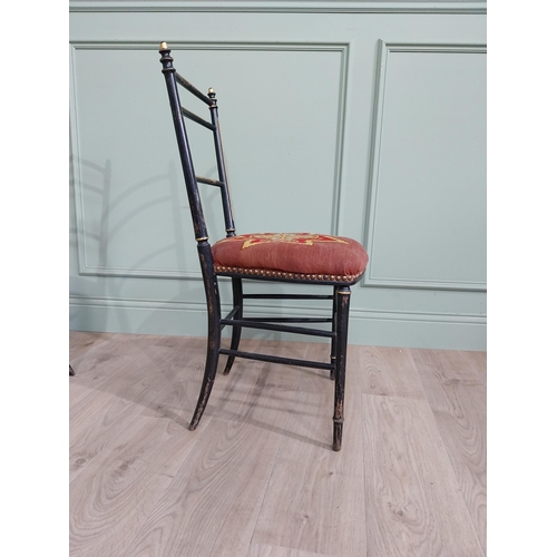 70 - Pair of ebonised bedroom chairs with tapestry upholstered seats raised on tapered legs {86 cm H x 43... 