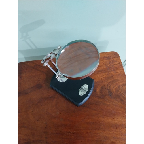 706 - Chrome desk magnifying lamp mounted on ebonised base {22 cm H x 13 cm W x 18 cm D}.