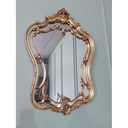 708 - French decorative gilt wall mirror {91 cm H x 61 cm W}.