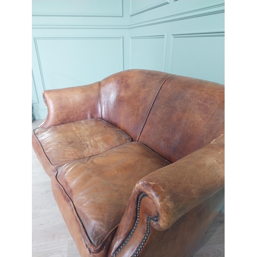 71 - French hand-dyed leather two seater upholstered sofa raised on square tapered legs {82 cm H x 143 cm... 