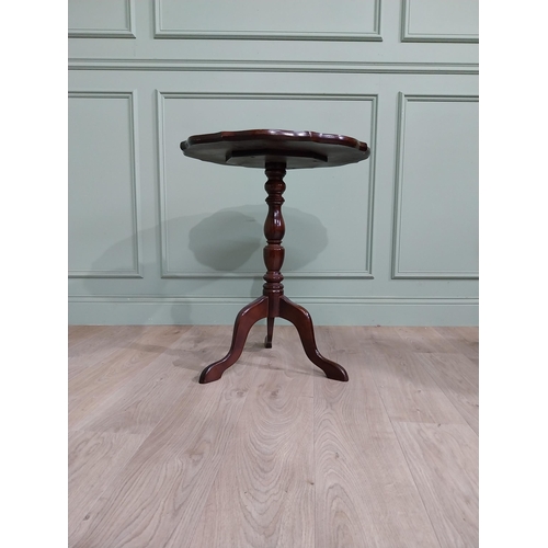 711 - Late 19th. C. mahogany wine table with pie crust top above a turned spiral column and three out swep... 