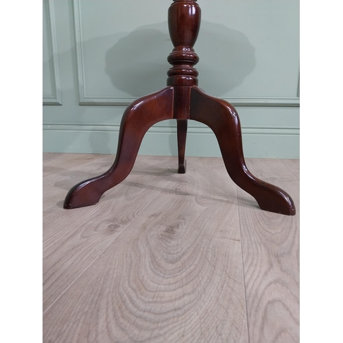 711 - Late 19th. C. mahogany wine table with pie crust top above a turned spiral column and three out swep... 