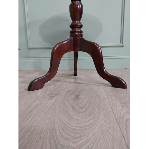 711 - Late 19th. C. mahogany wine table with pie crust top above a turned spiral column and three out swep... 