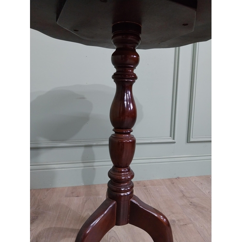 711 - Late 19th. C. mahogany wine table with pie crust top above a turned spiral column and three out swep... 