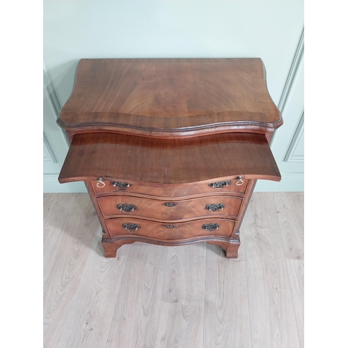 713 - Good quality Edwardian serpentine front bachelors chest  with brushing slide above four graduated dr... 