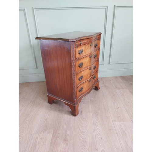 713 - Good quality Edwardian serpentine front bachelors chest  with brushing slide above four graduated dr... 