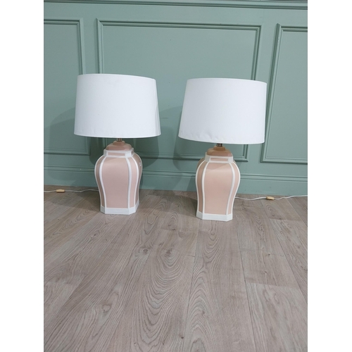 721 - Pair of painted terracotta table lamps with cloth shades {70 cm H x 42 cm Dia.}.