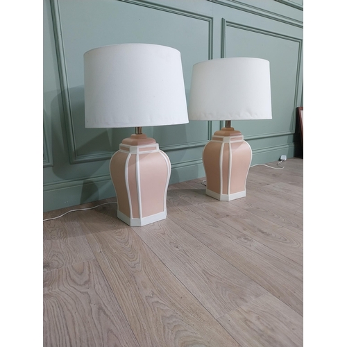 721 - Pair of painted terracotta table lamps with cloth shades {70 cm H x 42 cm Dia.}.