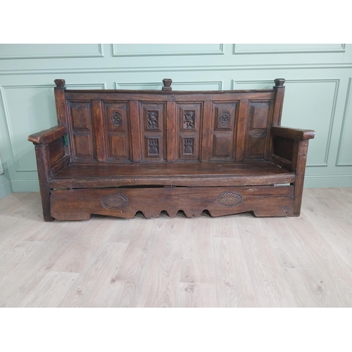 723 - 18th C. carved oak castle bench decorated with Lions and Castles {109 cm H x 206 cm W x 72 cm D}.