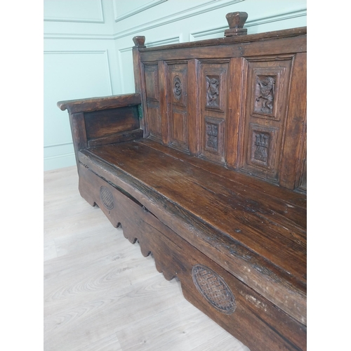 723 - 18th C. carved oak castle bench decorated with Lions and Castles {109 cm H x 206 cm W x 72 cm D}.