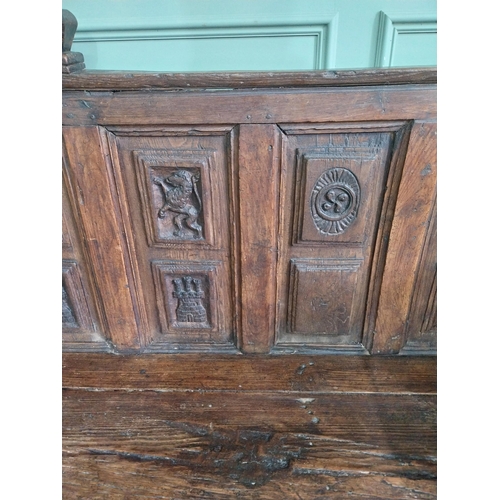 723 - 18th C. carved oak castle bench decorated with Lions and Castles {109 cm H x 206 cm W x 72 cm D}.