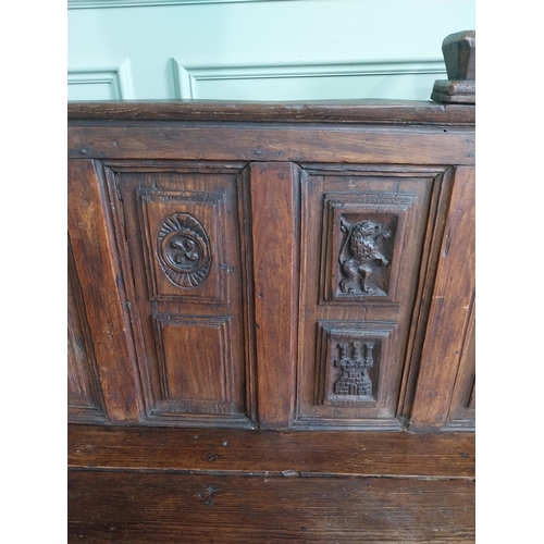 723 - 18th C. carved oak castle bench decorated with Lions and Castles {109 cm H x 206 cm W x 72 cm D}.