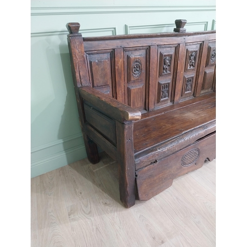 723 - 18th C. carved oak castle bench decorated with Lions and Castles {109 cm H x 206 cm W x 72 cm D}.