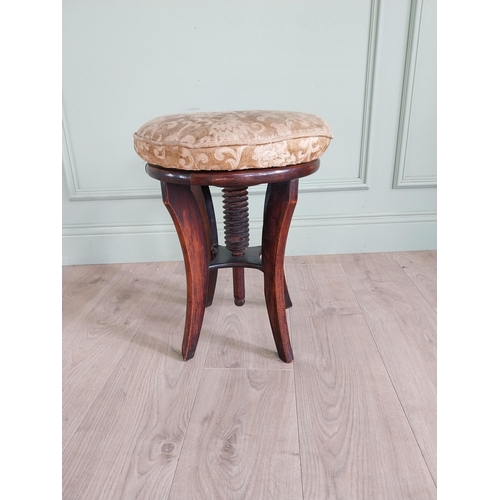 737 - Victorian mahogany revolving piano stool with upholstered seat {49 cm H x 38 cm Dia.}.