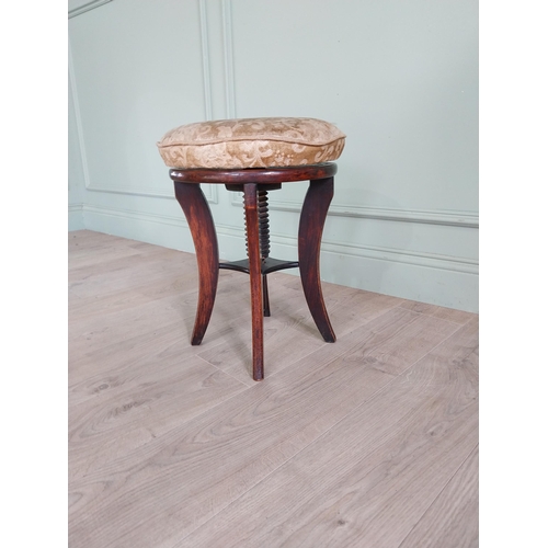 737 - Victorian mahogany revolving piano stool with upholstered seat {49 cm H x 38 cm Dia.}.