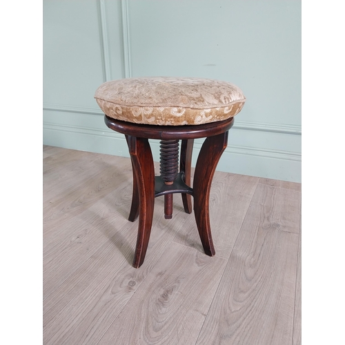 737 - Victorian mahogany revolving piano stool with upholstered seat {49 cm H x 38 cm Dia.}.