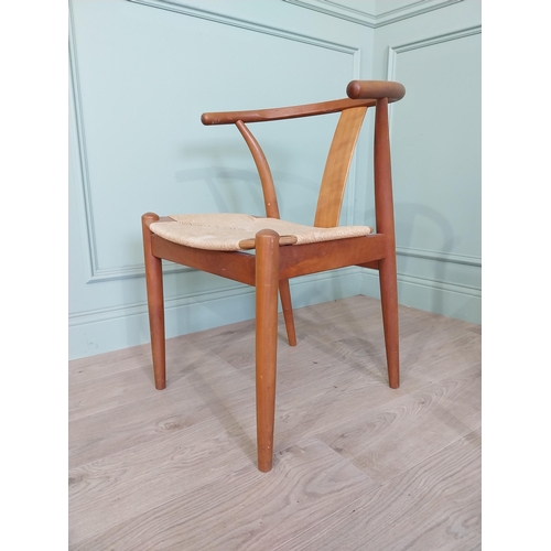 740 - Set of four Danish teak dining room armchairs with rush seats raised on tapered legs {76 cm H x 54 c... 