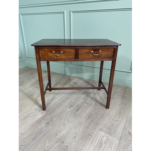 746 - Georgian mahogany writing table with two short drawers in the frieze raised on square legs and singl... 