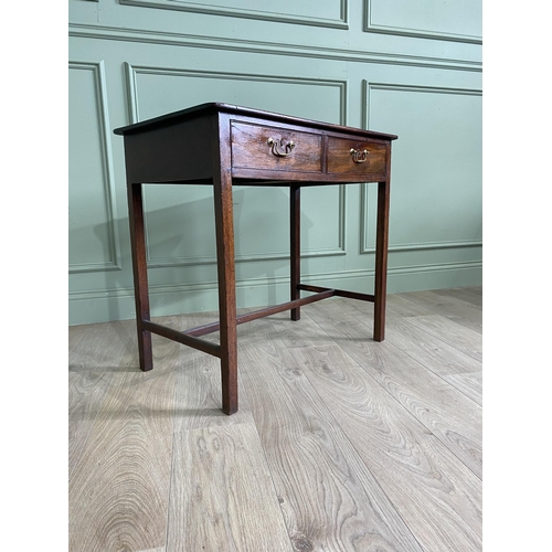 746 - Georgian mahogany writing table with two short drawers in the frieze raised on square legs and singl... 