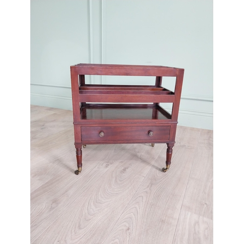 752 - Good quality 19th C. mahogany canterbury with single drawer raised on turned legs and brass castors ... 