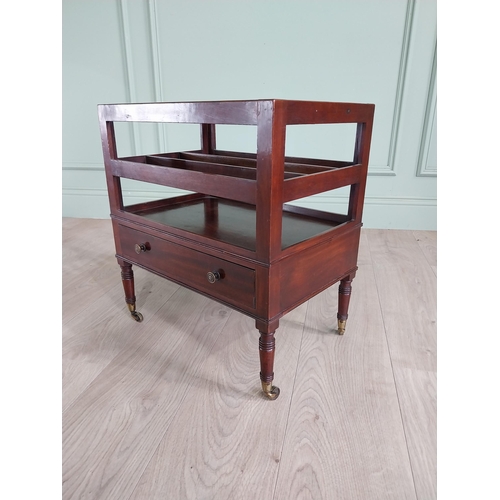 752 - Good quality 19th C. mahogany canterbury with single drawer raised on turned legs and brass castors ... 