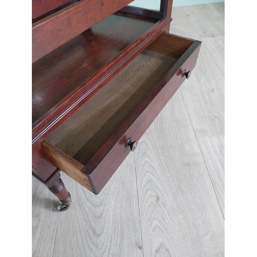 752 - Good quality 19th C. mahogany canterbury with single drawer raised on turned legs and brass castors ... 