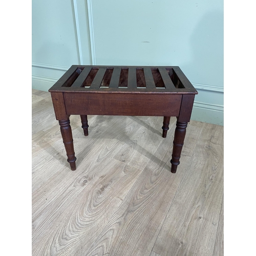 76 - Victorian mahogany luggage rack raised on turned legs {44 cm H x 57 cm W x 37 cm D}.