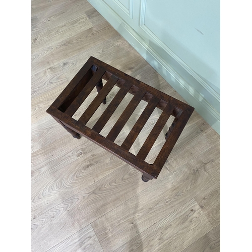 76 - Victorian mahogany luggage rack raised on turned legs {44 cm H x 57 cm W x 37 cm D}.