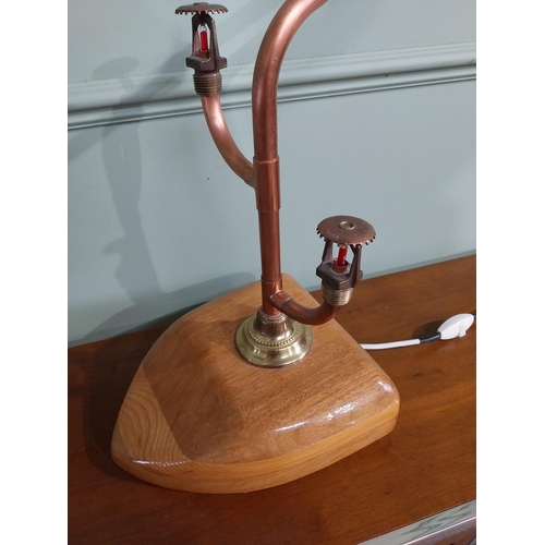 777 - Brass and copper Steam Punk table lamp mounted on oak plinth {57 cm H x 50 cm W x 20 cm D}.